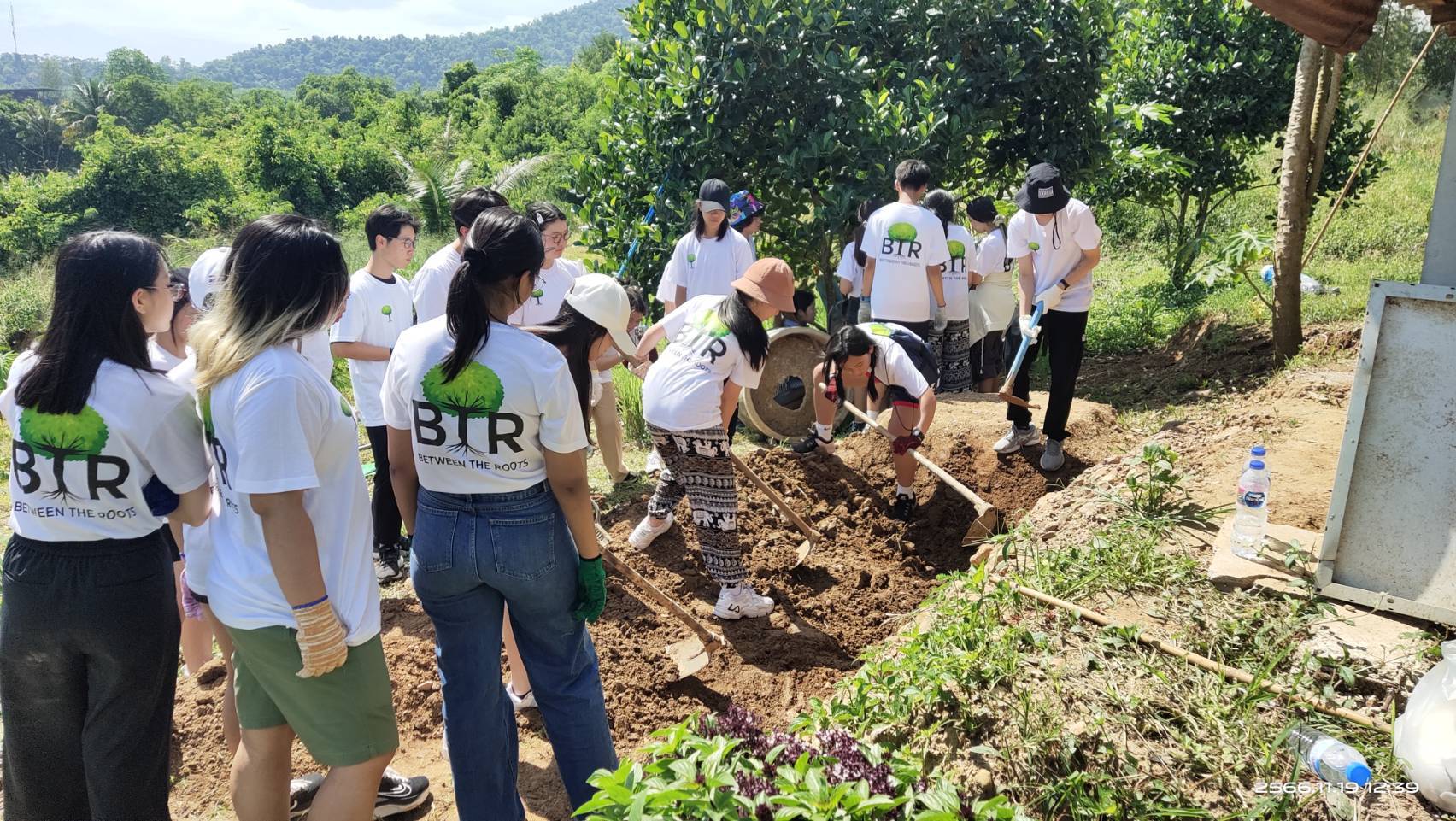Between The Roots volunteers working together on a service trip