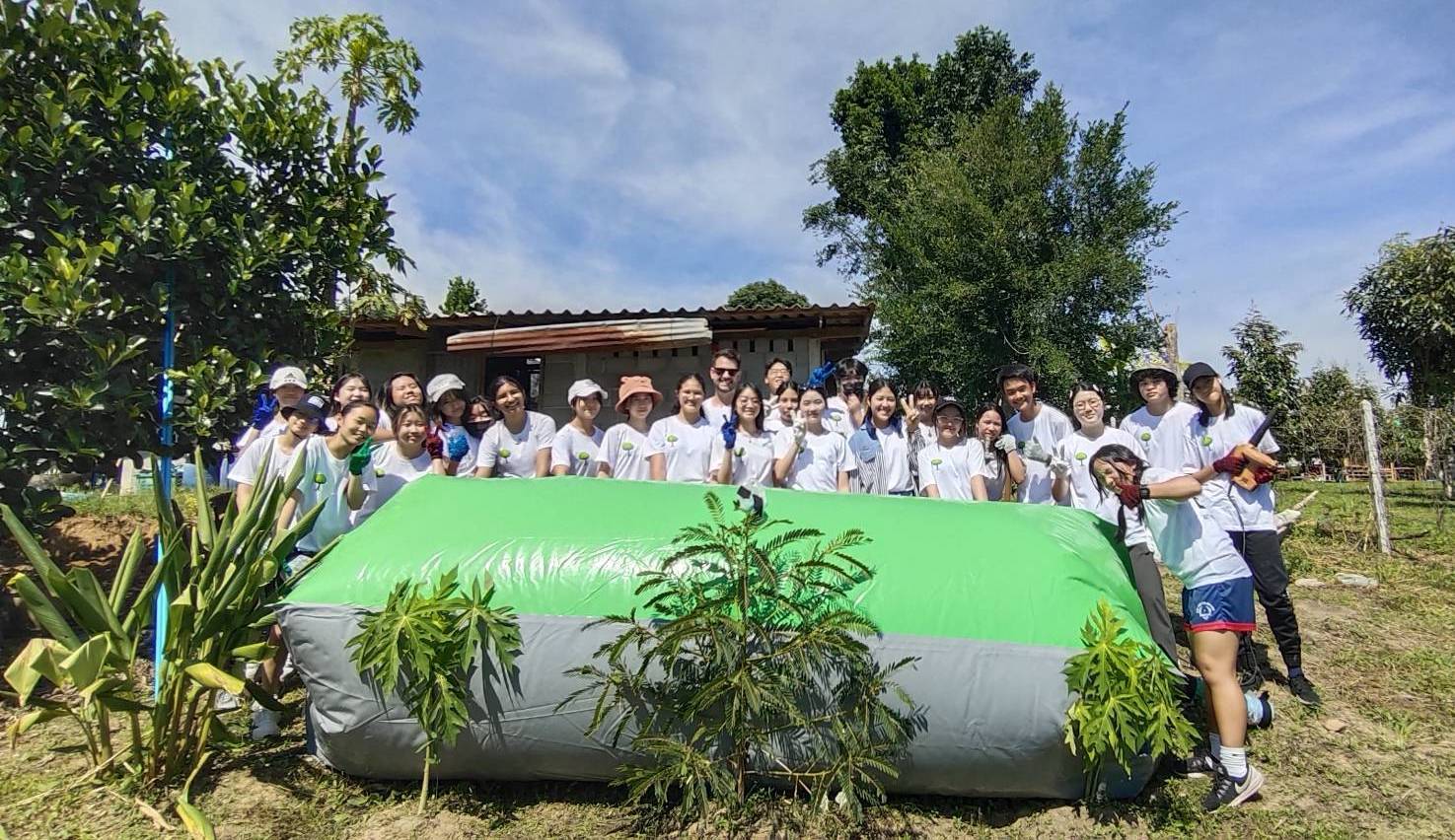 BTR members gathered around a newly installed biogas balloon
