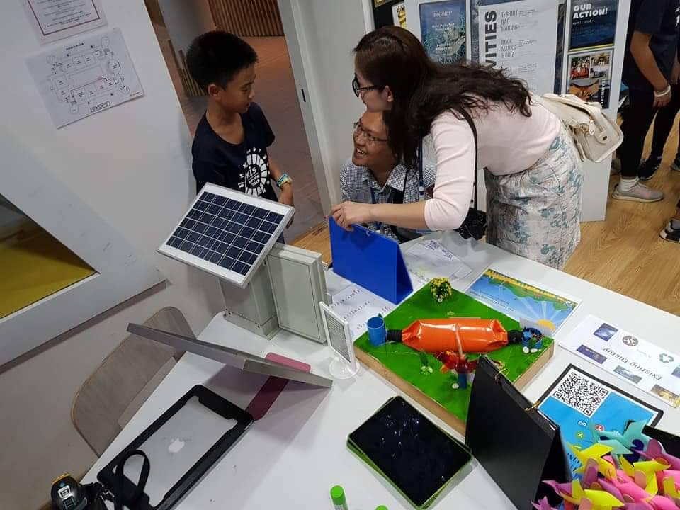 A renewable energy project display with a small solar panel